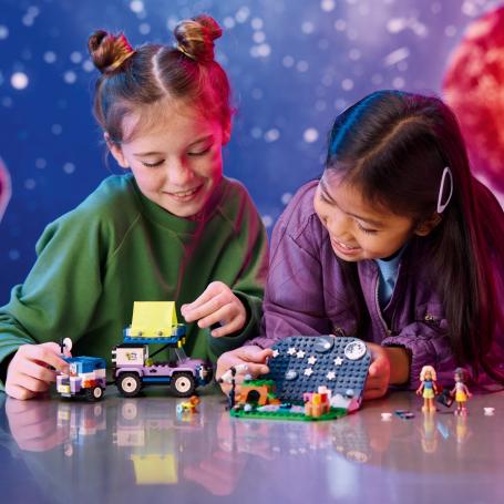 Two girls playing with LEGO®.