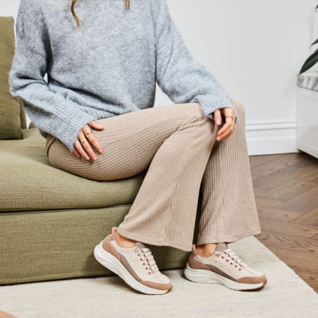 Woman wearing Skechers Cozy Fit