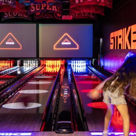 Kids playing Strike Bowling