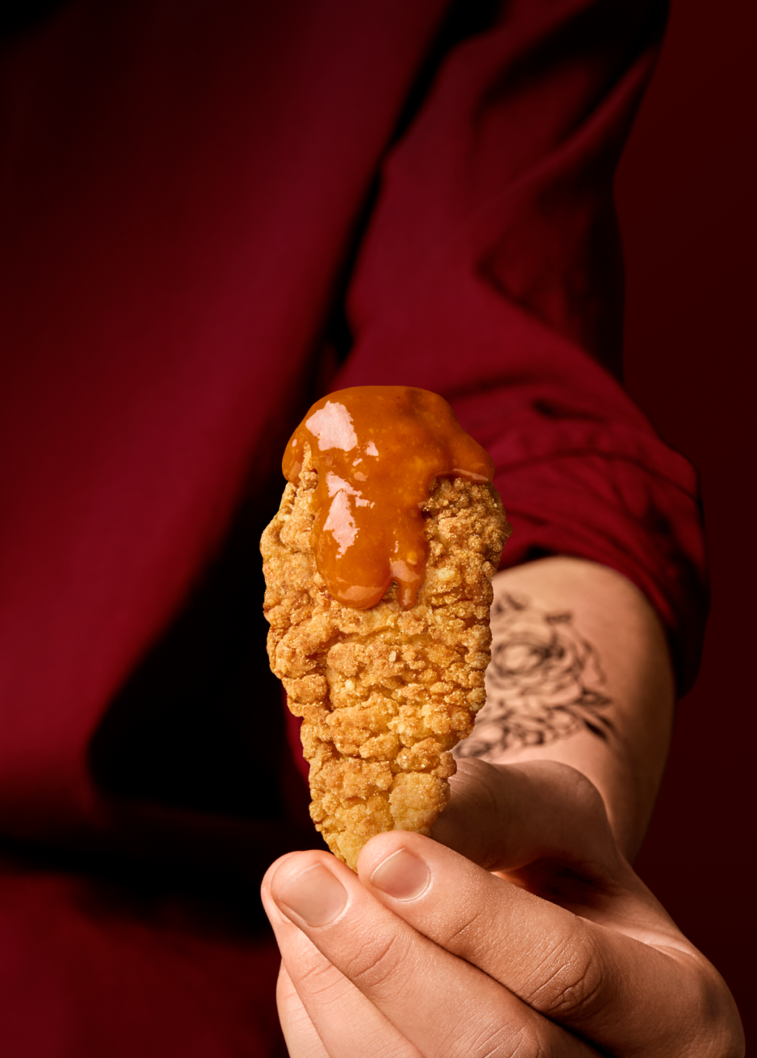 Image of a Grill'd chicken tender with sauce