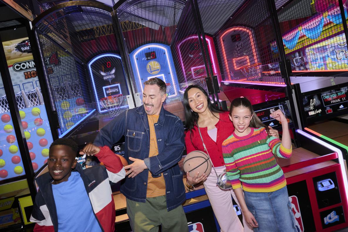 father and mother with two kids at archie brothers