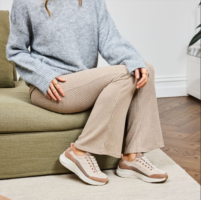 Woman wearing Skechers Cozy Fit