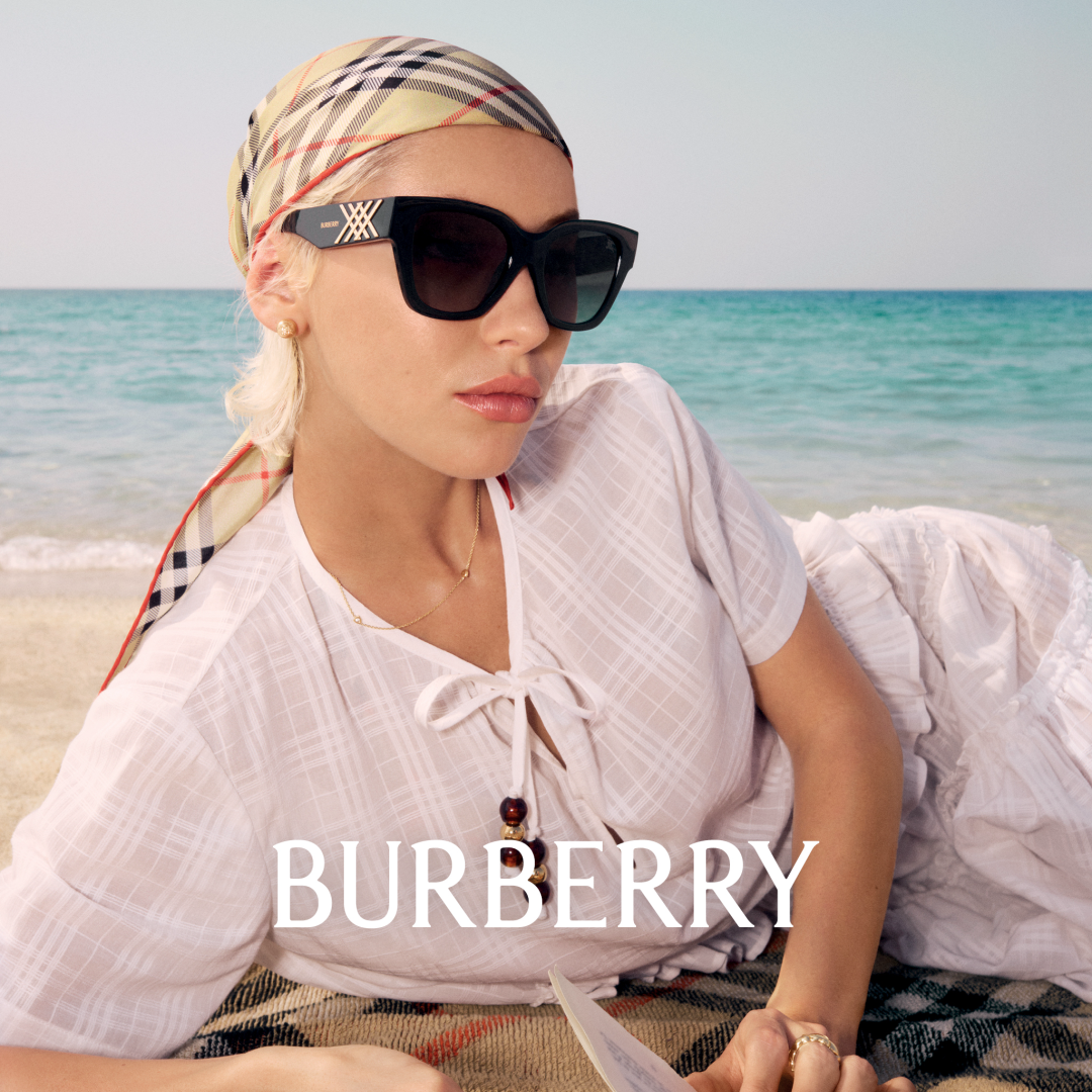 Woman at the beach, wearing Burberry sunglasses