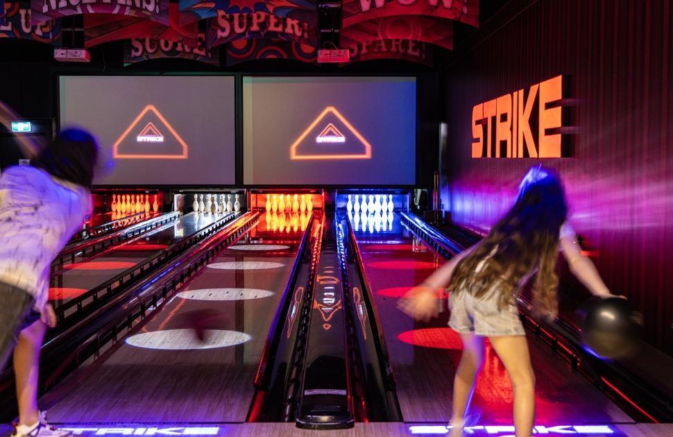 Kids playing Strike Bowling